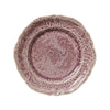 A lavender colored ceramic plate with a floral and geometric ornate pattern and fine decorative crackles.
