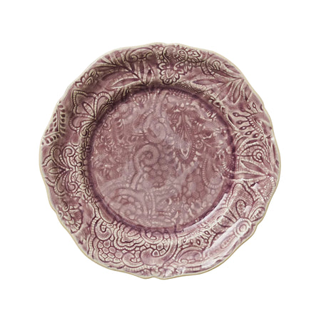 A lavender colored ceramic plate with a floral and geometric ornate pattern and fine decorative crackles.