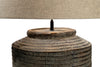 Rustic wooden lamp base with a beige lampshade on a white background
