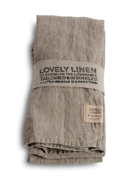A pack of four beige Lovely Linen tailored wrinkled napkins, with a label showing the brand name and 'Tailored & Wrinkled'. They are folded and displayed on a white background.
