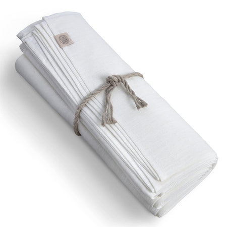 Folded white blanket with a brand logo on a white background