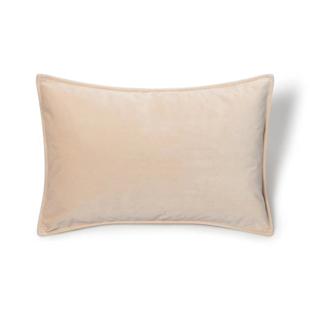 A cream velvet oblong cushion with a soft texture, displayed against a white background.