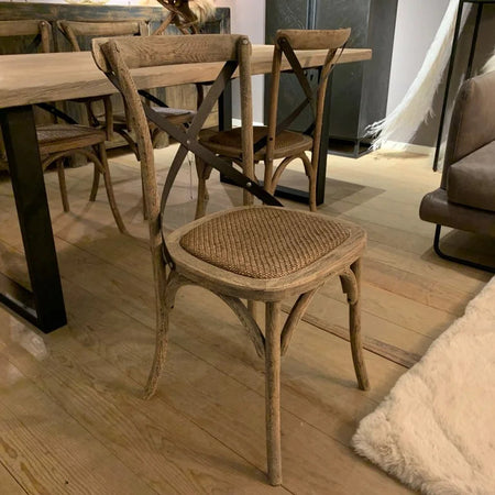 Dining area with wooden table and chairs in a modern interior setting.