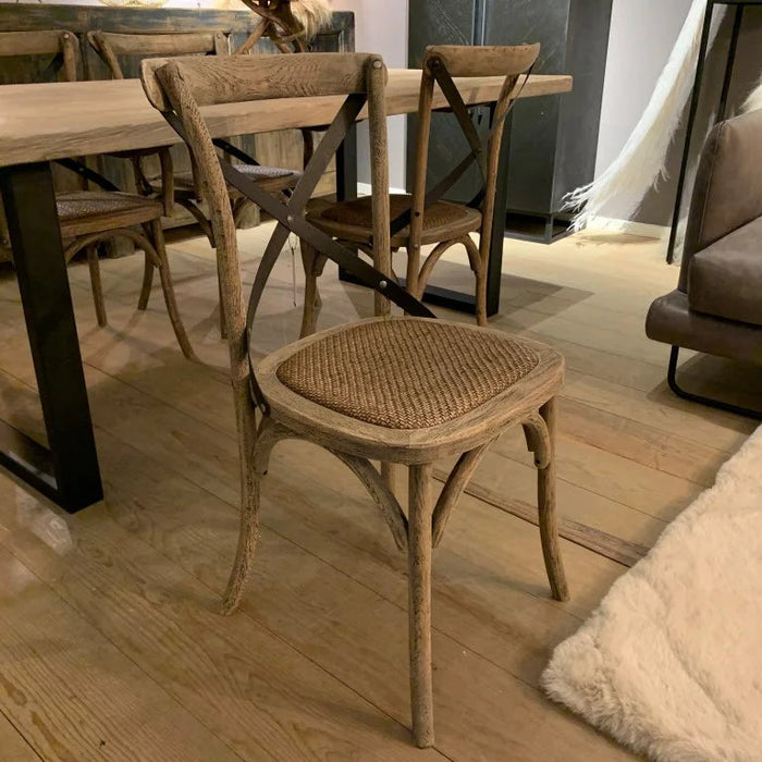 Dining area with wooden table and chairs in a modern interior setting.