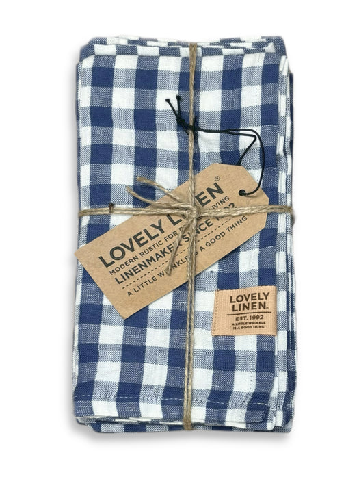 Set of blue check linen napkins tied with string 