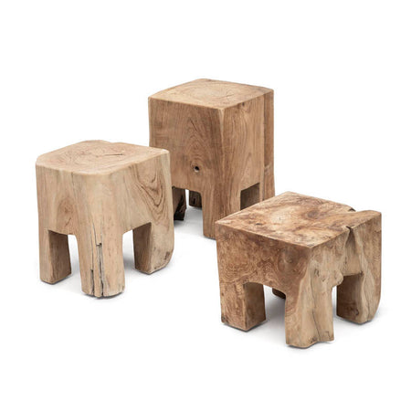Three wooden stools of varying sizes on a white background