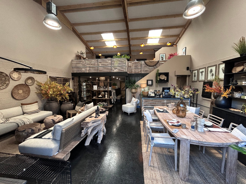 Garden Gate Hambledon barn-style showroom displaying Gommaire teak furniture and luxury homewares