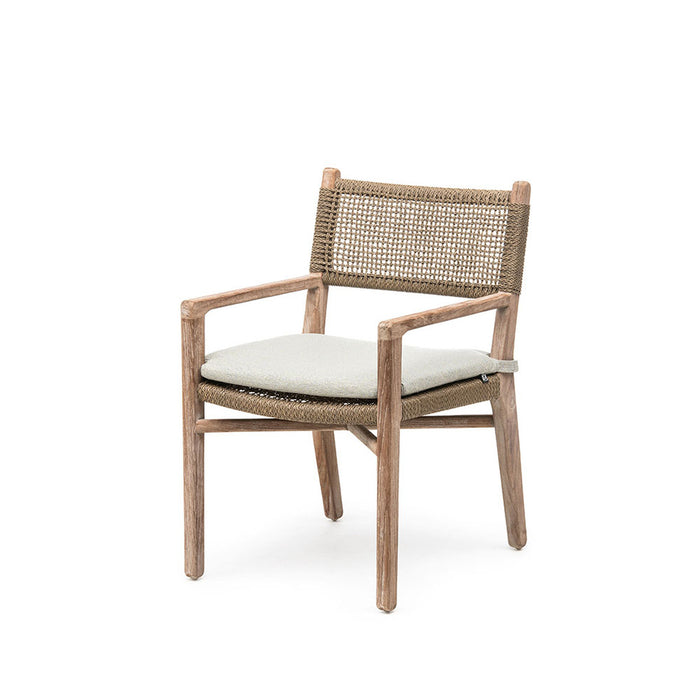 Chair with woven backrest and armrests and a white cushion on a white background