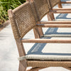 Wicker chairs with cushions on a patio