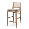 Teak bar stool with woven backrest and seat on a white background