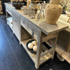 Old pine console table with decorative items in a room setting