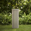 A tall cylindrical outdoor lantern with a woven beige rope body, a silver metal top handle, and a silver metal base, shown on a solid white background.