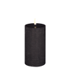 Black LED pillar candle with rustic finish on a white background.