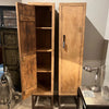 Wooden cabinet with open doors in a room setting