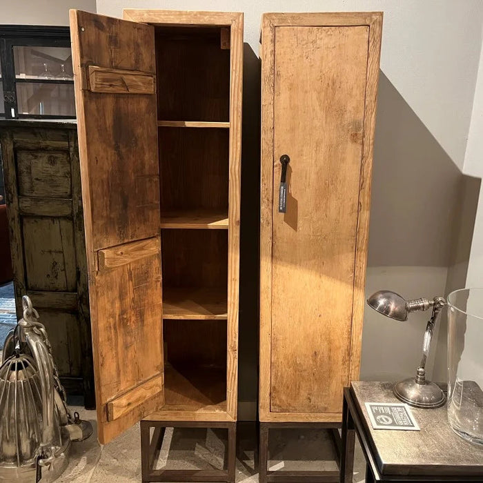 Wooden cabinet with open doors in a room setting