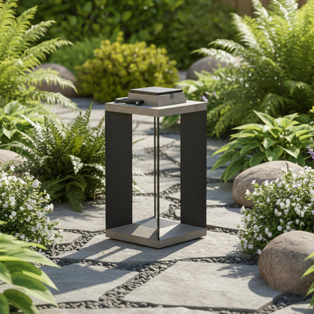 Decorative outdoor solar lantern with handle set against a natural background.