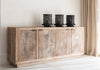 Reclaimed wood sideboard with three black lanterns on a light-colored floor.