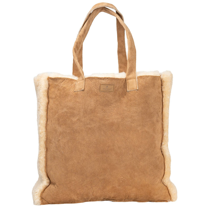 Beige suede and sheepskin shopping bag on a white background